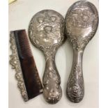 Antique silver brush set includes mirror brush and comb