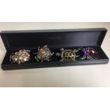 4 Large Designer Costume Rings by Butler and Wilson all set with Coloured stones in good condition