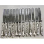 12 silver handled Knives