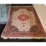 Beige ground keshan carpet measures approx 2.3m by 1.6m