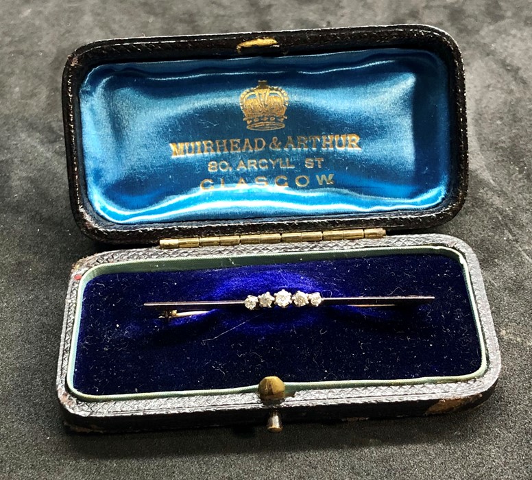 Antique boxed Diamond brooch 5 small diamonds set in yellow metal measures approx 50mm long