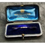 Antique boxed Diamond brooch 5 small diamonds set in yellow metal measures approx 50mm long