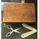 Carved wooden box containing ivory knife and ivory scissors