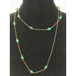 gold and green stone bead necklace