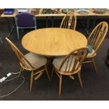 Ercol Blonde round extending table, 4 swan back Ercol chairs