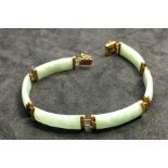 Chinese 14ct gold mounted jade Bracelet hallmarked 585 on clasp measures appox 18.5cm long and 8mm w