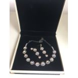 Designer Costume Necklace and Earring set by Butler and Wilson all set with stones in good condition