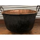 Large copper handled cauldron
