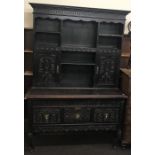 Cupboard backed dresser, carved panels with Cabriole leg on front