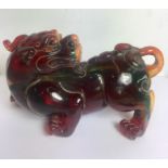 Large Amber Type Chinese FU Dog Figure mesures approx 7ins wide by 4.5ins tall