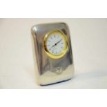 Bentley Desk Clock Silver This item is a silver desk clock with a Winged B logo at the base of the