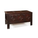 A Charles II oak panelled chest