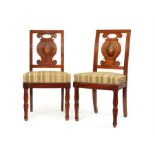 A pair of Empire mahogany and sycamore marquetry side chairs