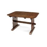 An oak plank-top trestle table
