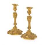 A pair of late 19th century French gilt bronze candlesticks