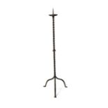 A floor-standing tripod pricket candle-stick, 19th century