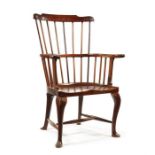 A George III mahogany comb-back Windsor library armchair, circa 1780