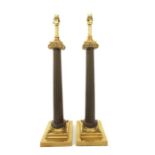 A pair of bronze and brass mounted table lamps