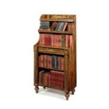 A Regency simulated coromandel and parcel gilt open bookcase