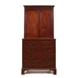 A George III mahogany secretaire cabinet possibly by Philip Bell