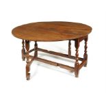 A large Charles II oak gate-leg table