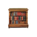 A Victorian satinbirch and mahogany carved open bookcase