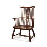 A George III ash, cherry and figured elm Windsor armchair, circa 1760, West Country