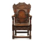 A Charles II oak armchair