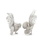 A large pair of Dutch silver cockerel table ornaments