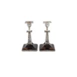 Pair of late Victorian silver mounted and brown tortoiseshell dwarf candlesticks