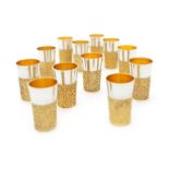 A set of twelve modern parcel-gilt silver beakers by Stuart Devlin, London