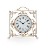 An Edwardian clock set in openwork silver stand