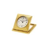 An 18k gold travel or desk clock by Cartier