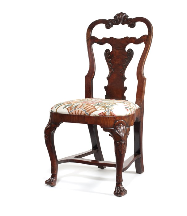 A Queen Anne Irish walnut carved dining chair