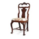A Queen Anne Irish walnut carved dining chair