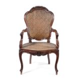 A mid 19th century Chinese export padouk armchair in the Louis XV style