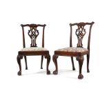 A pair of George III carved mahogany dining chairs