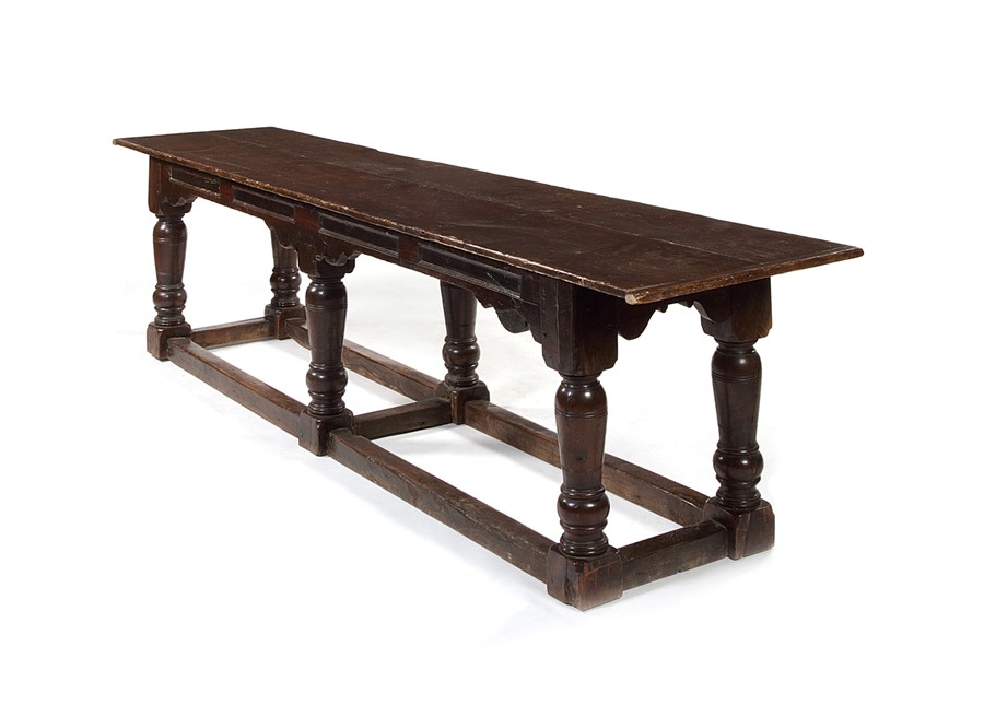 A large oak and pine six-leg table, the base 17th century, the top 19th century