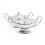 A pair of George III silver covered sauce tureens of navette form by John Scofield, London, 1791