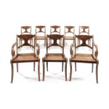 A set of six Regency faux rosewood dining chairs with a matching pair of later open armchairs