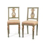 A pair of early 19th century green painted and parcel gilt salon chairs