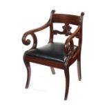 A Regency Scottish carved mahogany open armchair