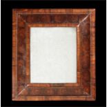 A William and Mary walnut oyster-veneered cushion frame mirror