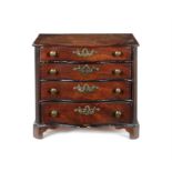 A miniature late George III serpentine mahogany 'apprentice piece' dressing chest