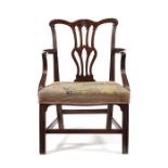 A George III mahogany open armchair in the Chippendale style