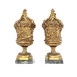 A pair of late 19th century French gilt bronze classical urns and covers of putti