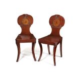 A pair of Regency mahogany hall chairs