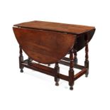 A Queen Anne oak gate-leg table