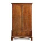 A George II walnut crossbanded and featherbanded press cupboard