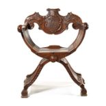 A mid-19th century Italian carved walnut 'Savonarola' chair